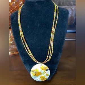 Yellow and orange seed bead and shell pendant necklace